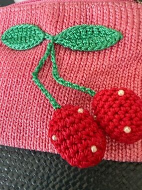 The Sak Pink Crochet Mini Bag with Green Leaf and Red Cherry Appliqué